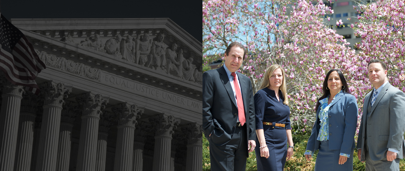 Group photo of Resnick Law Group with a backdrop of vibrant pink cherry blossoms in full bloom.